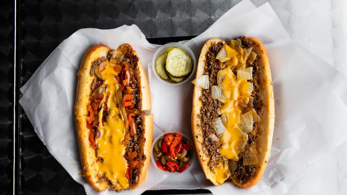 The History of the Philly Cheesesteak and Why It's Still America's Favorite Sandwich